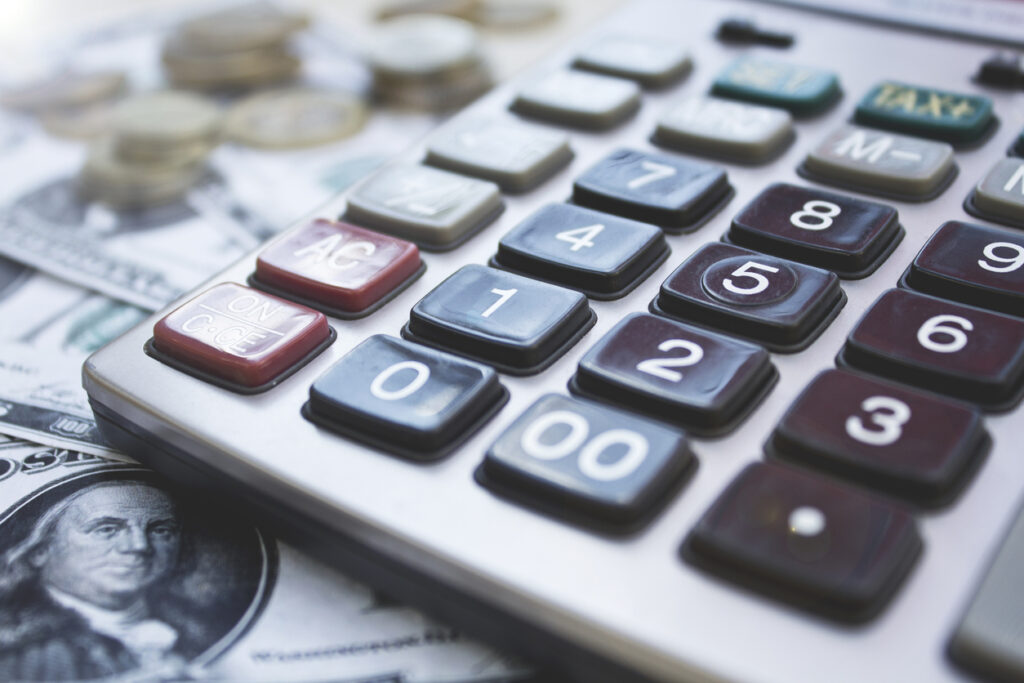 calculator on desk with money